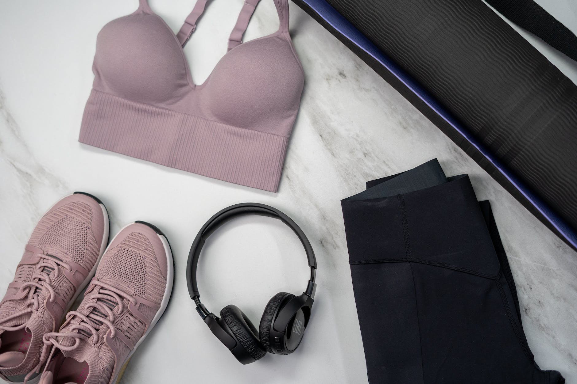womens pink bra on white textile
